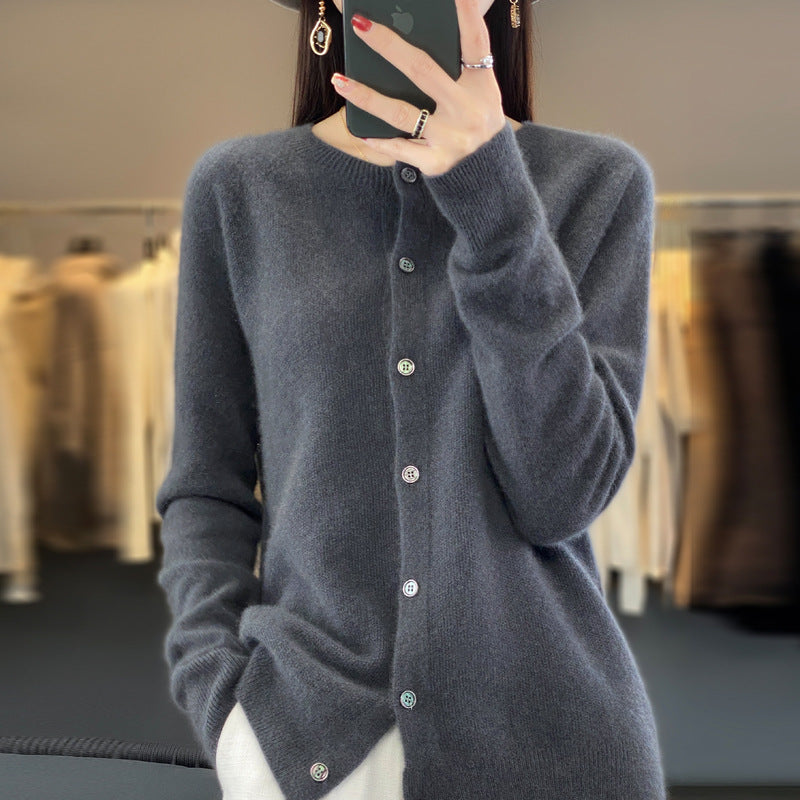 Front view of women's emerald green crewneck button cardigan with subtle ribbed trims