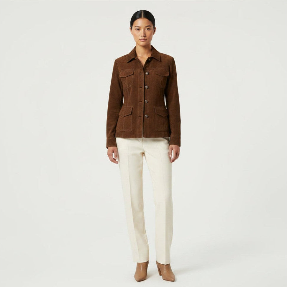 Model wearing a brown Season pestige suede velvet jacket with utility pockets and a retro collar, paired with cream trousers.